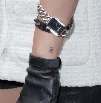 A picture of Kristen's four lines tattoo on her left wrist.